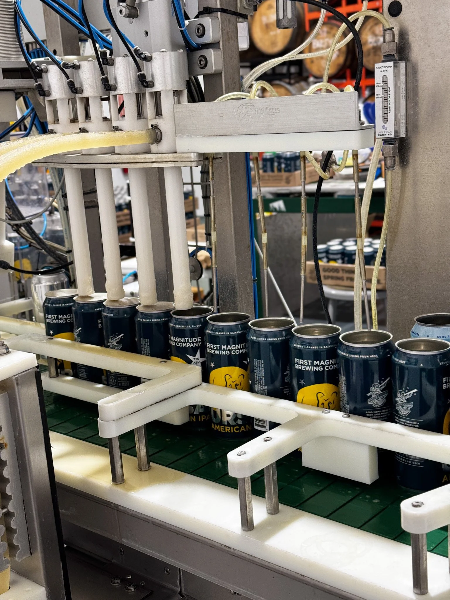 Ursa IPA 16 oz cans on canning line being filled