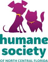 Humane Society of North Central Florida logo featuring two purple dogs with yellow collars above teal text.