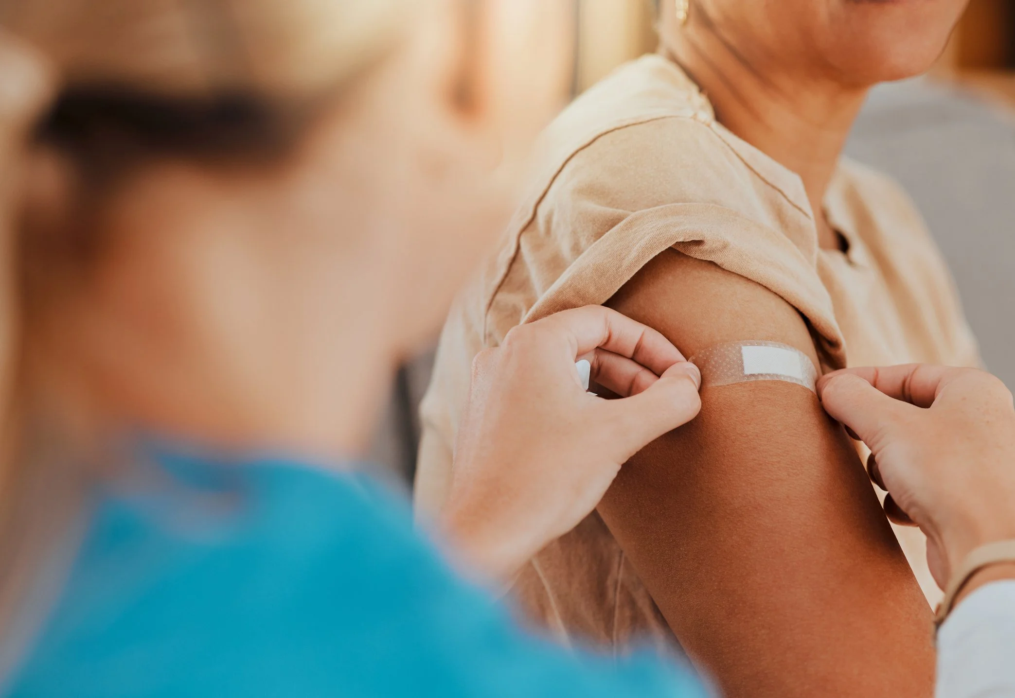 Person with band aid from vaccination