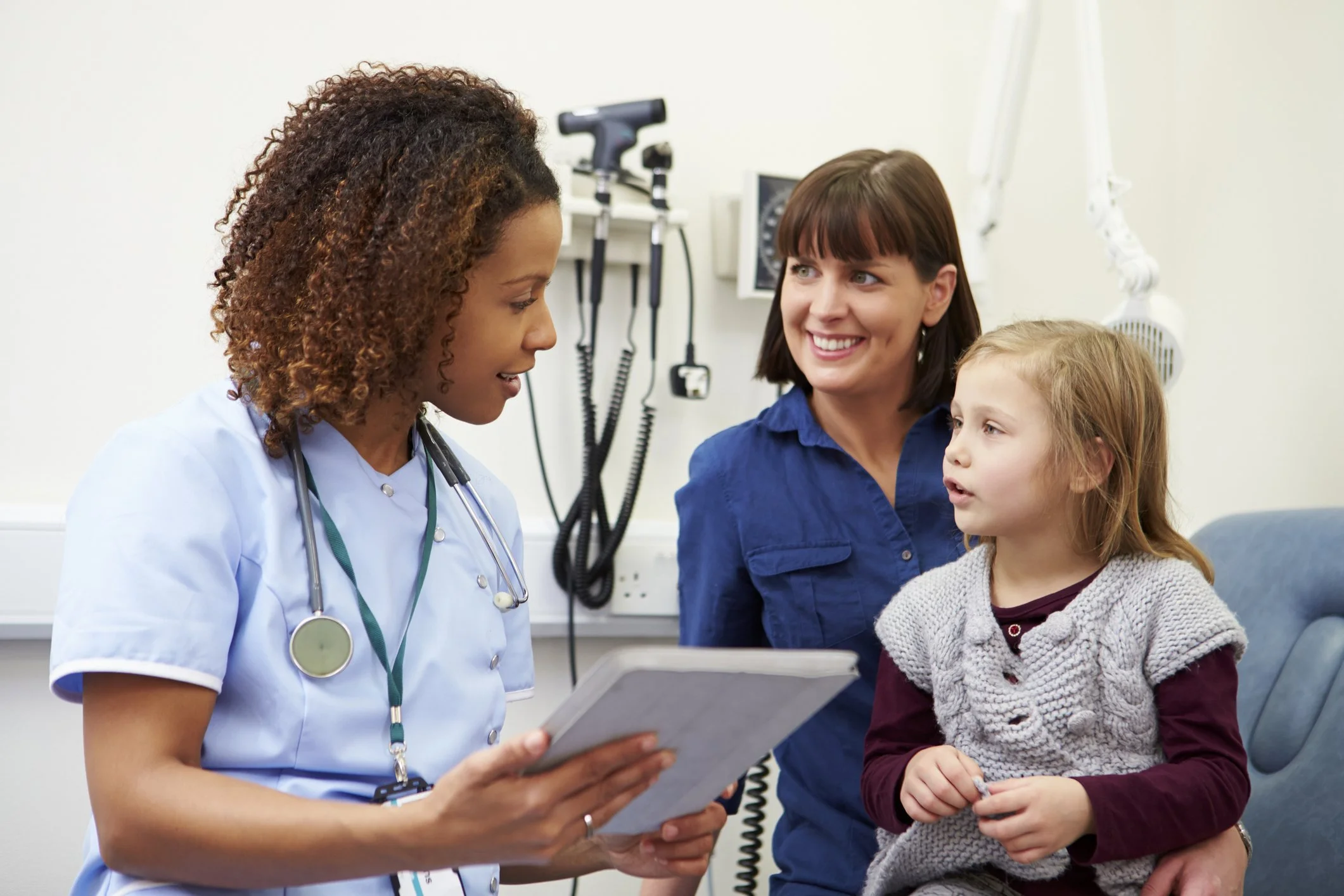 Nurse with mother and daughter