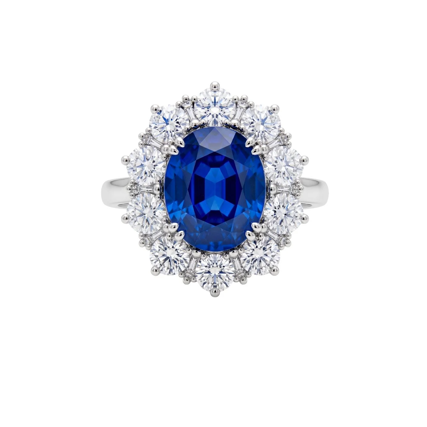 Silver ring with a large oval blue sapphire gemstone surrounded by a halo of small round diamonds.