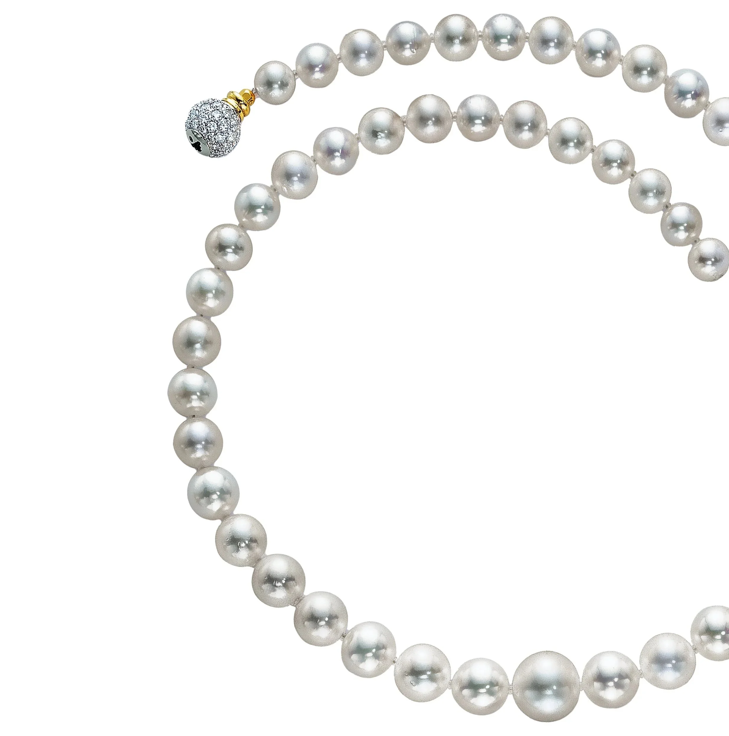 A string of white pearls with a silver and gold clasp.