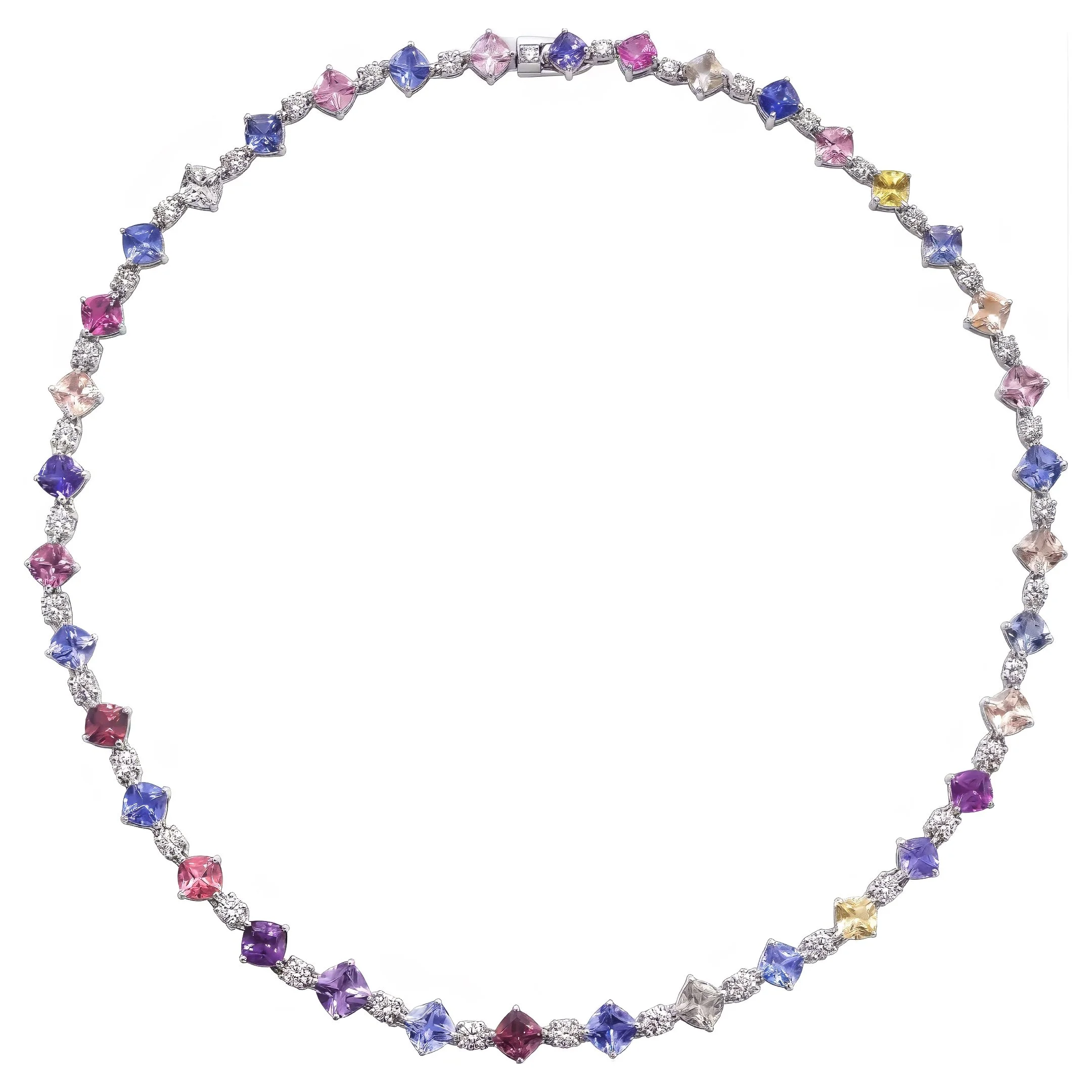 A necklace and matching bracelet decorated with colorful square-cut gemstones in pink, yellow, blue, and purple, accented with small clear diamonds, displayed against a white background.