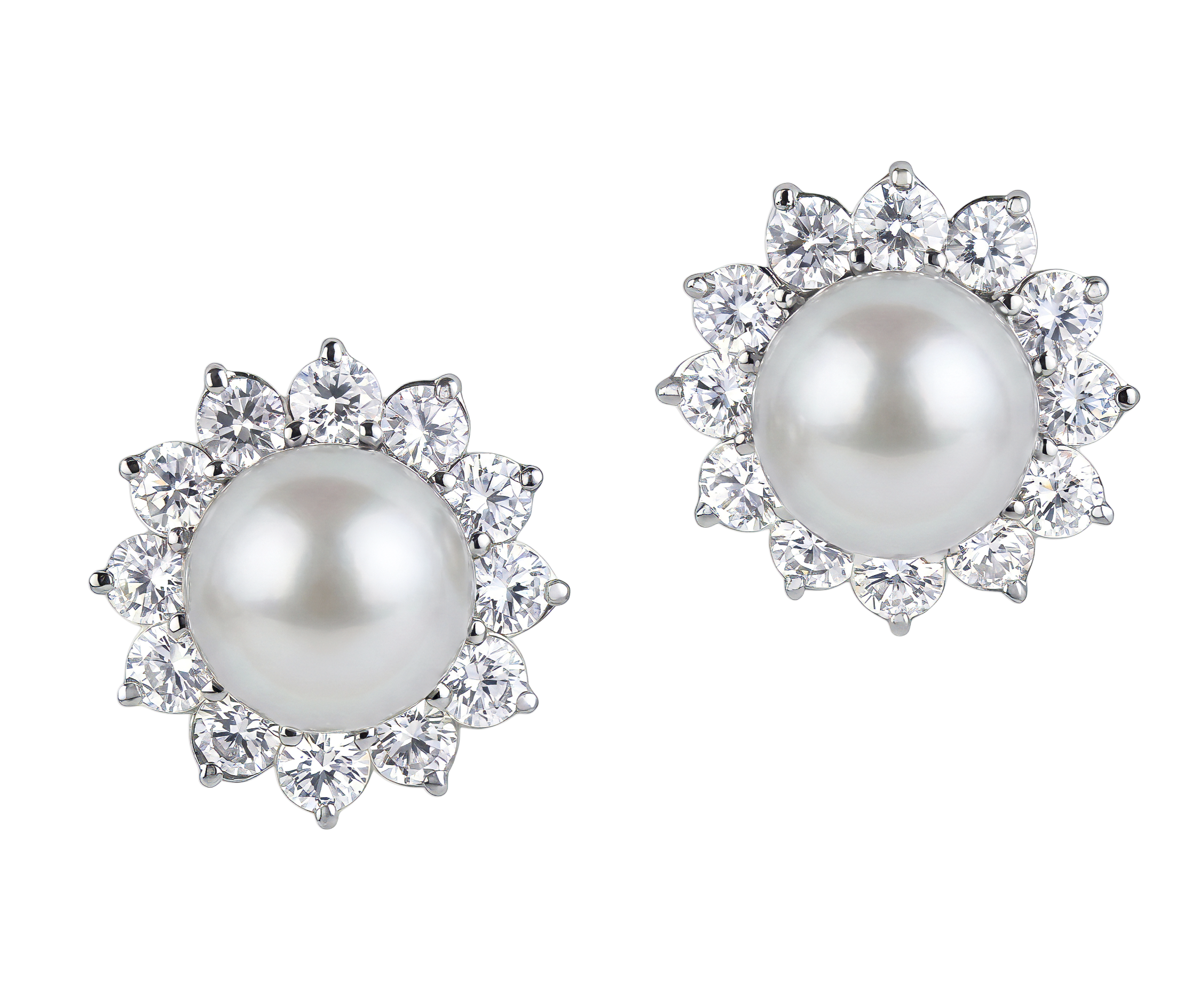 Elegant pearl earrings surrounded by a halo of sparkling clear gemstones on black background.