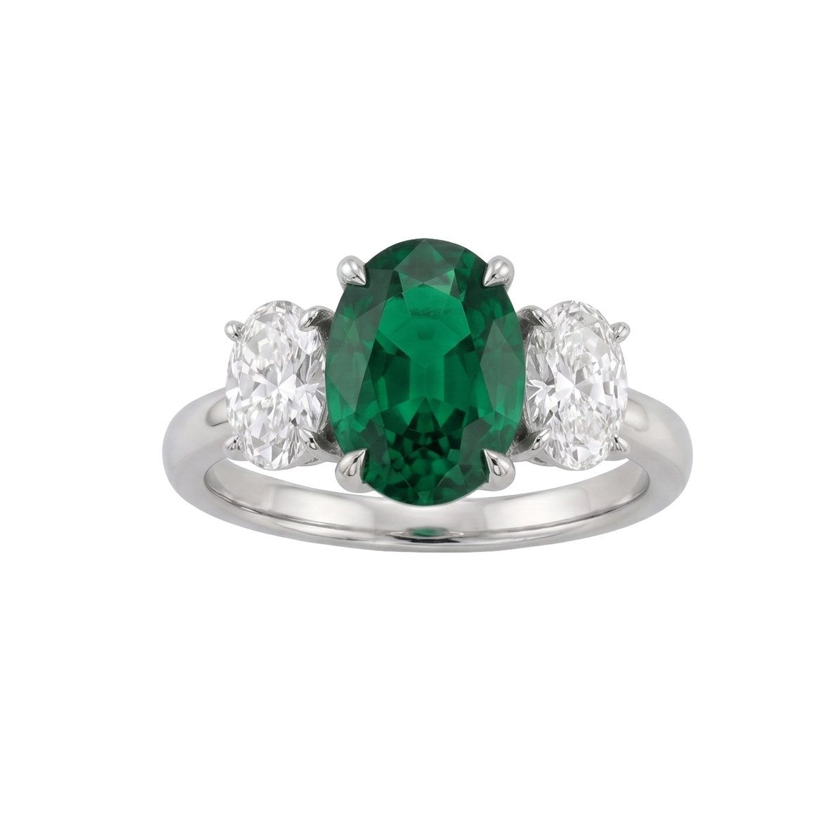 Silver ring with a large green gemstone and two smaller clear diamonds on each side.