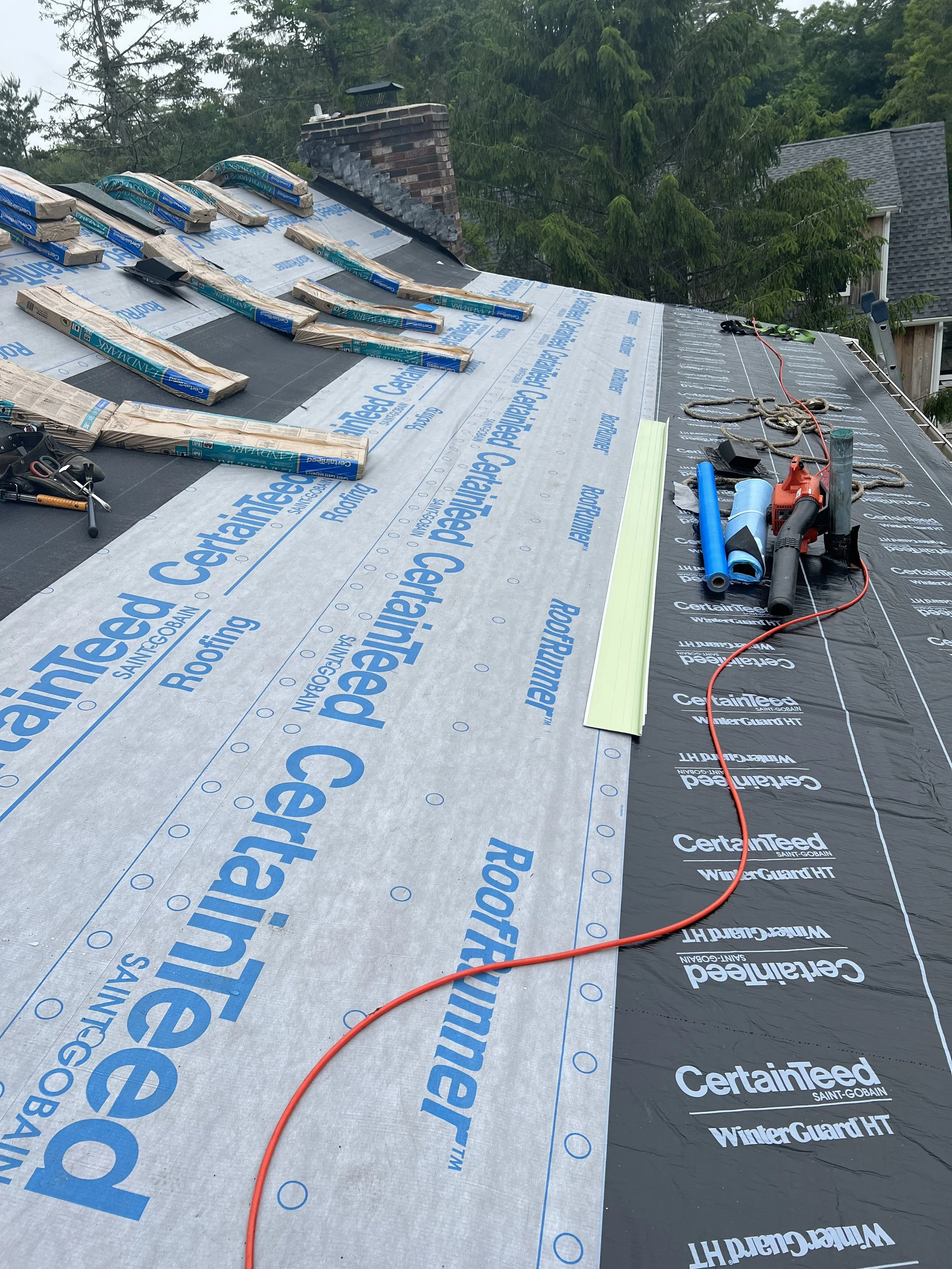 Roof installation in Cape Cod, MA with CertainTeed underlayment and waterproof ice and water shield for durable weather protection.