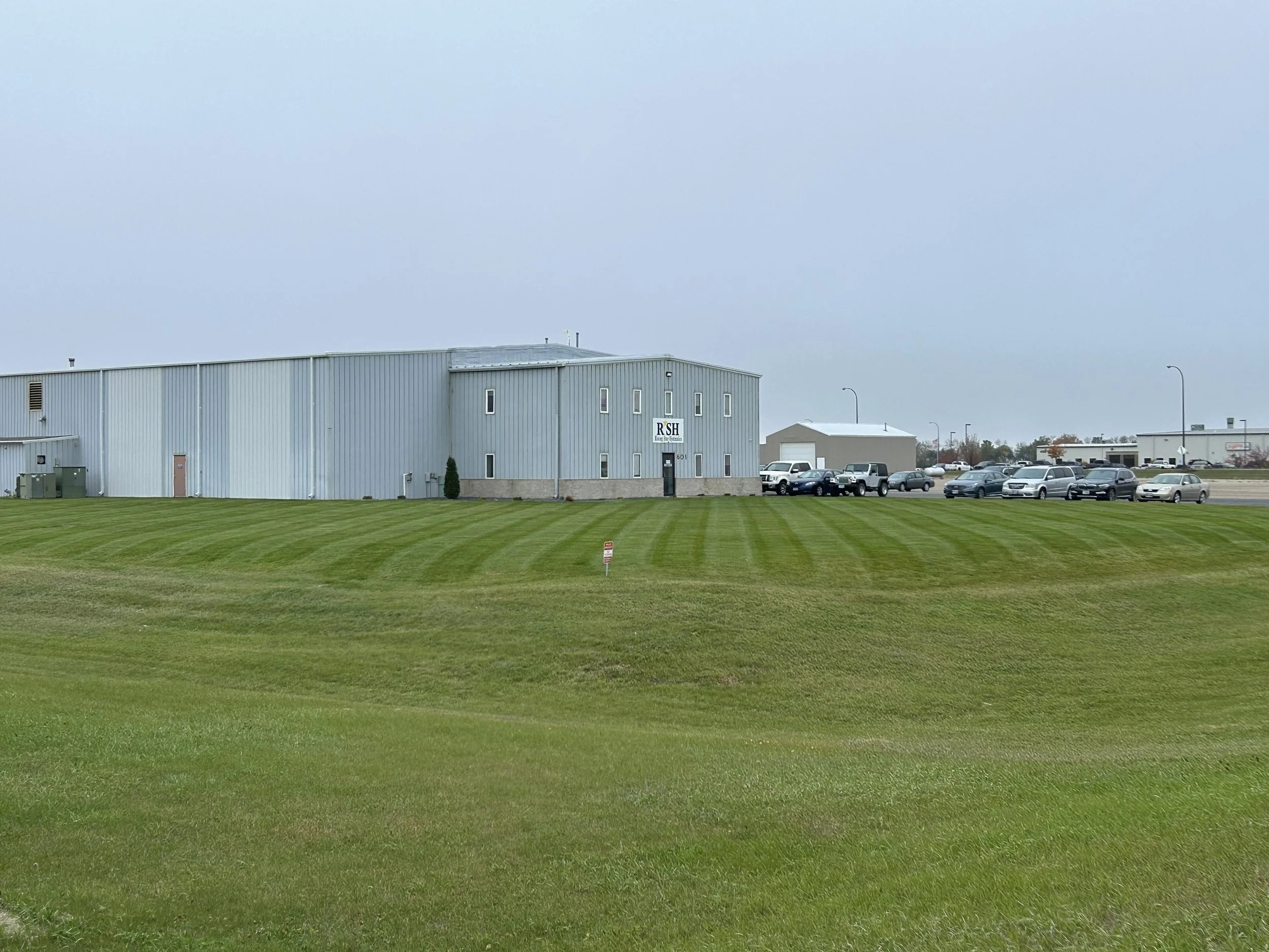 Commercial lawn mowing services in Watertown, SD with clean striping and professional maintenance for large business properties.