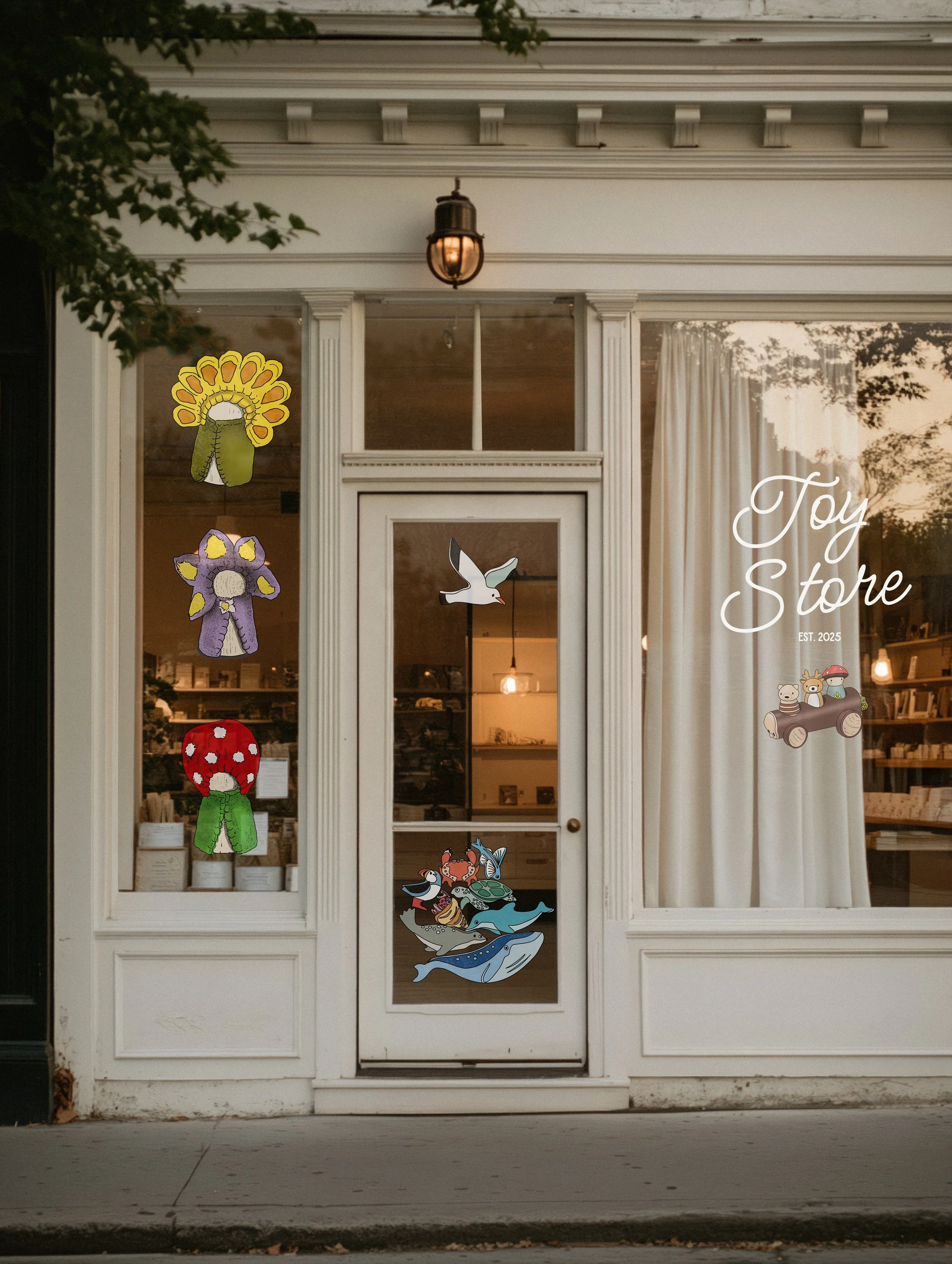 storefront with painted paper cutout art, including flowers, a flying bird, stacked animal figures, and the words "Toy Store" and "EST. 2025" on the window.