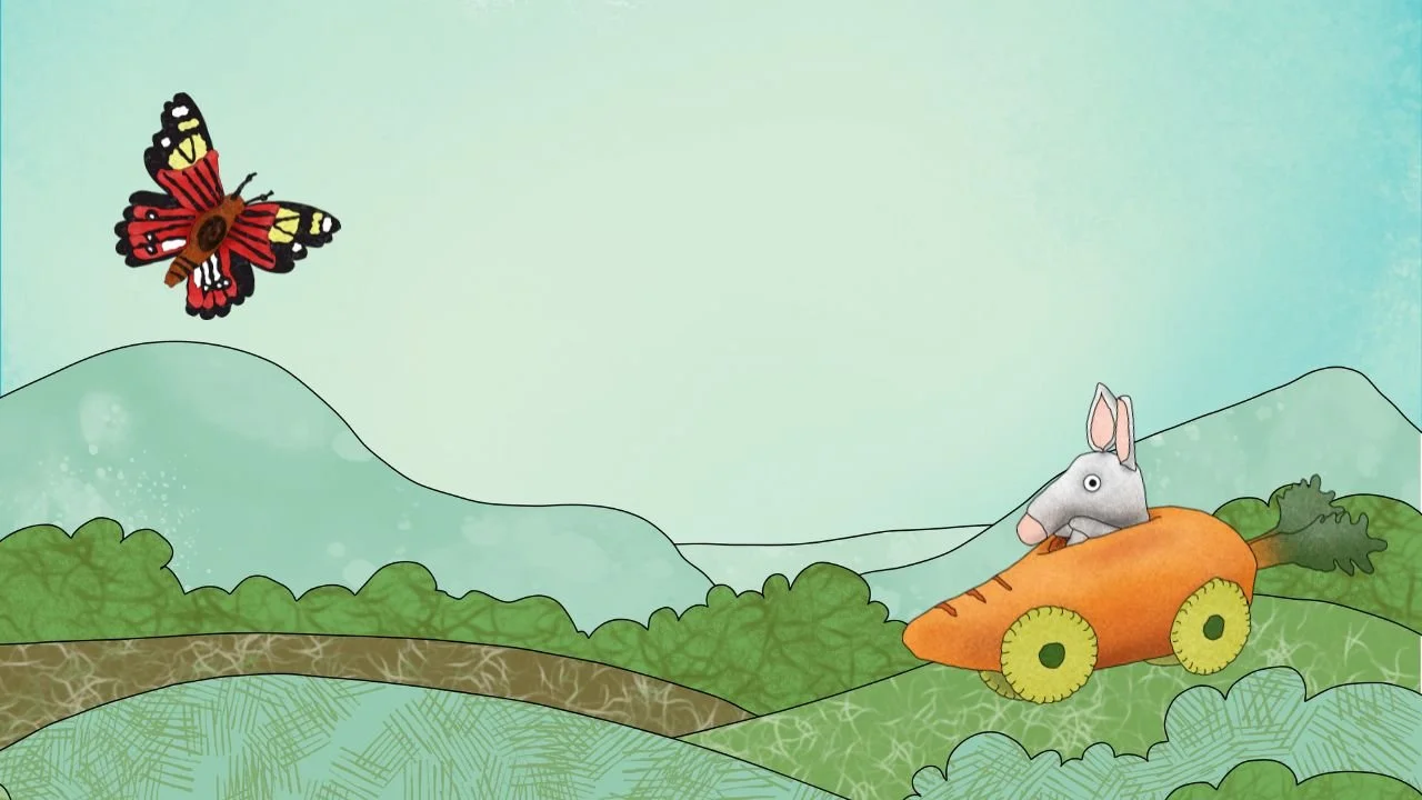 A cartoon illustration of a mouse with large ears riding in a carrot-shaped vehicle with wheels, flying in the sky above green rolling hills, with a butterfly flying nearby.