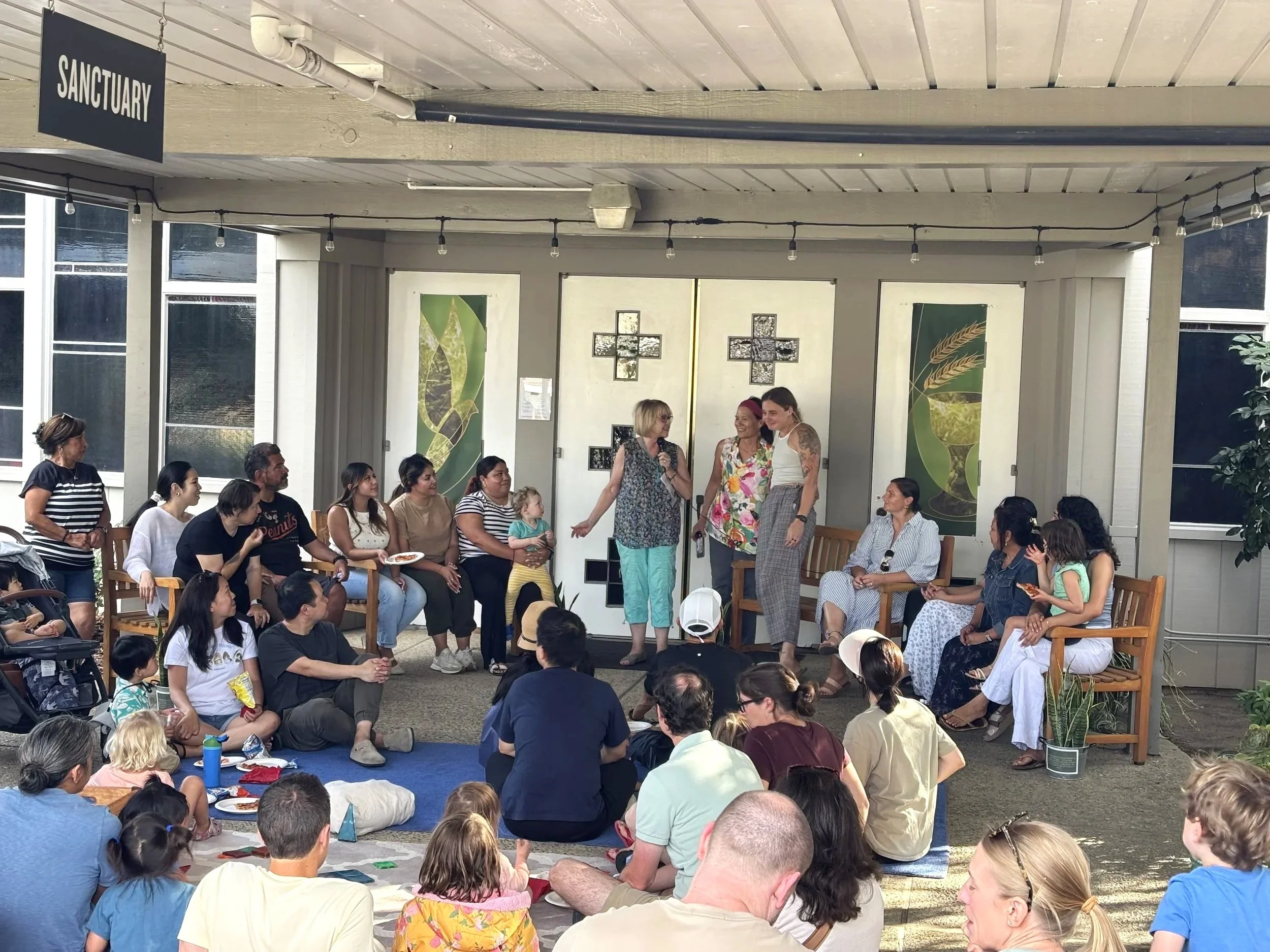 families of little acorn preschool gather on the patio in front of first presbyterian church mountain view sanctuary doors