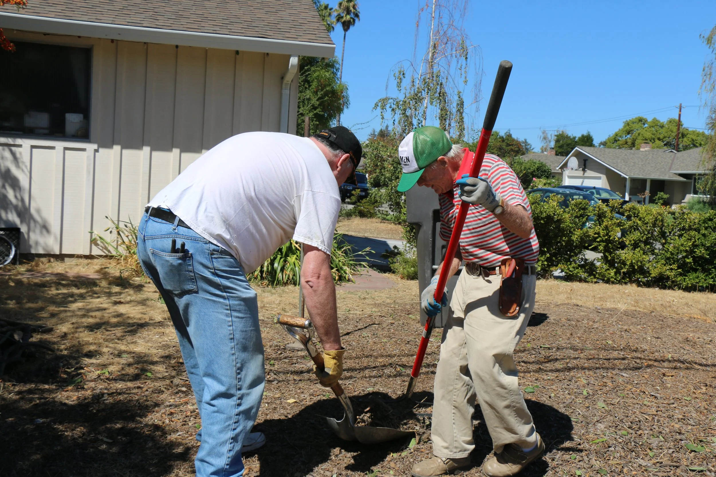 Two members of FPCMV volunteer gardening in Mountain View