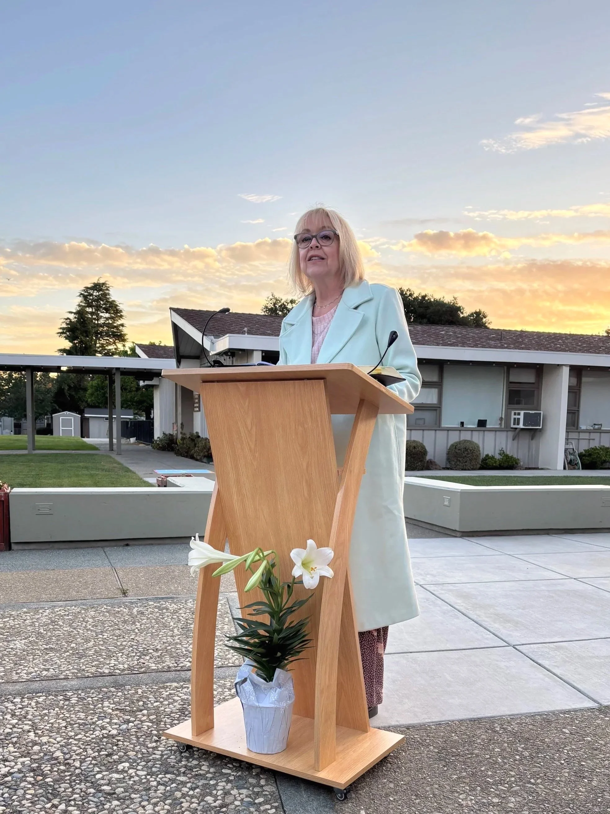 Pastor speaking outdoors at First Presbyterian Church of Mountain View during a worship gathering at sunrise on Easter
