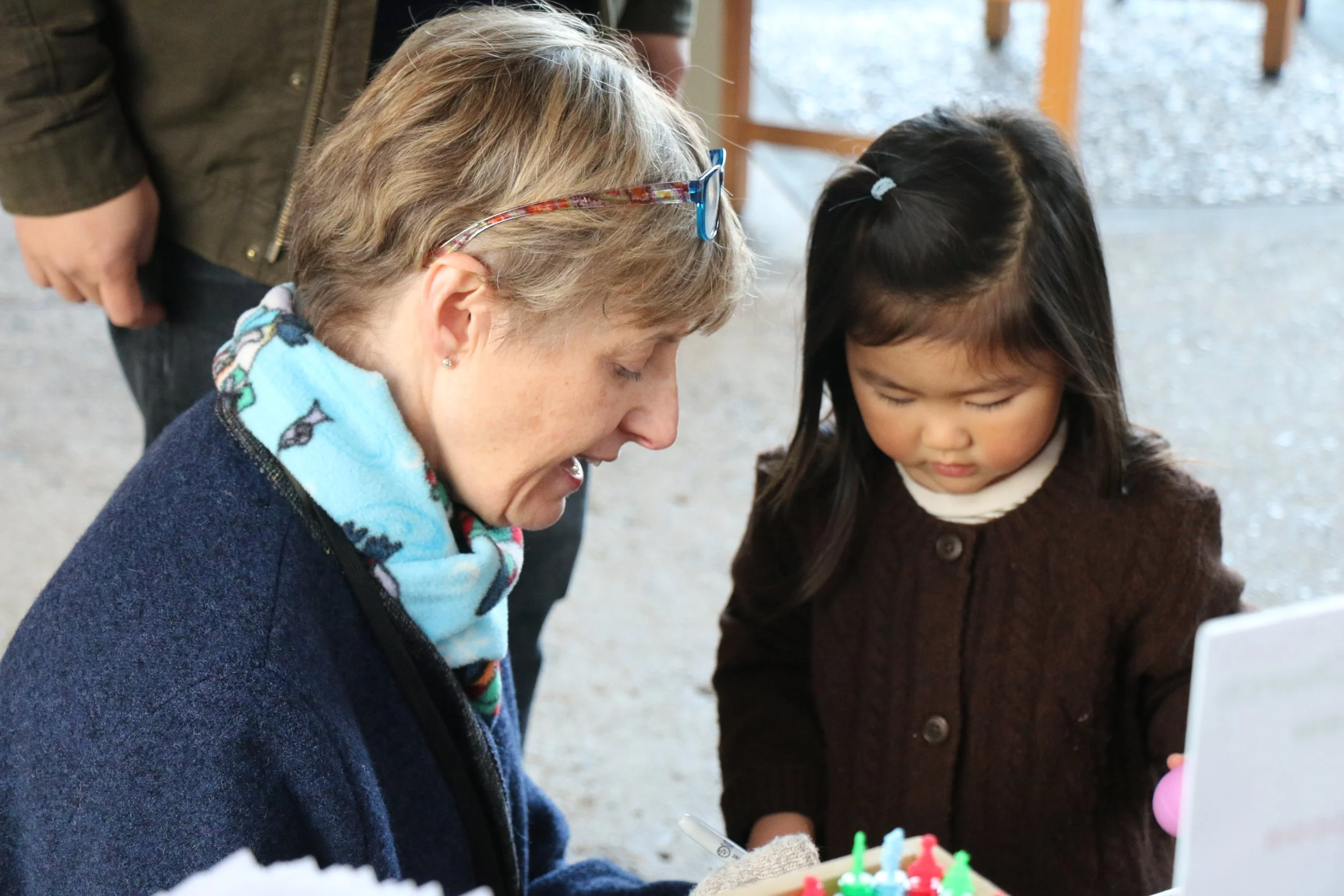 A child explores toys at FPCMV Carols, Cookies, and Cocoa Christmas Party