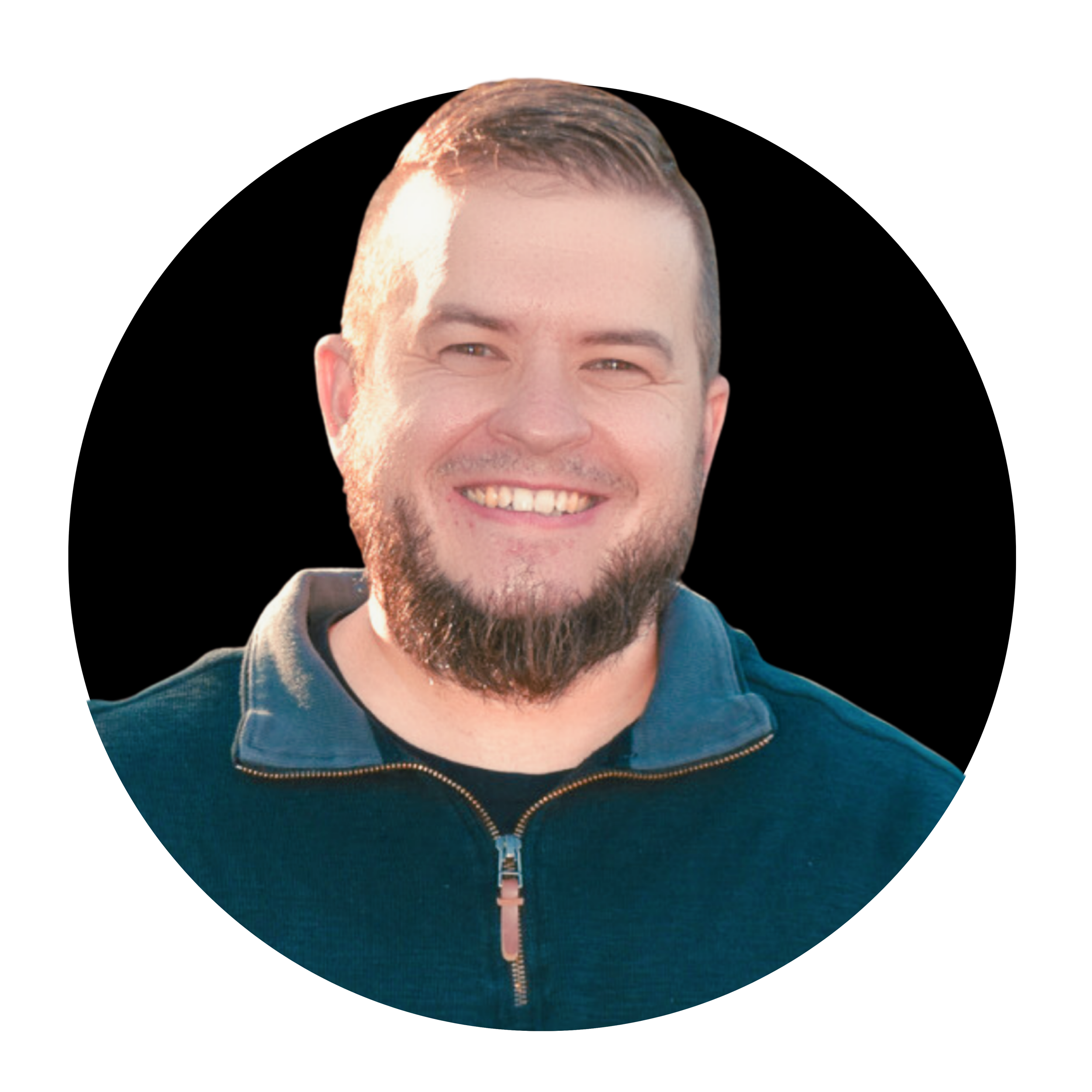 A smiling man with a beard, wearing a dark zip-up jacket, against a black circular background.