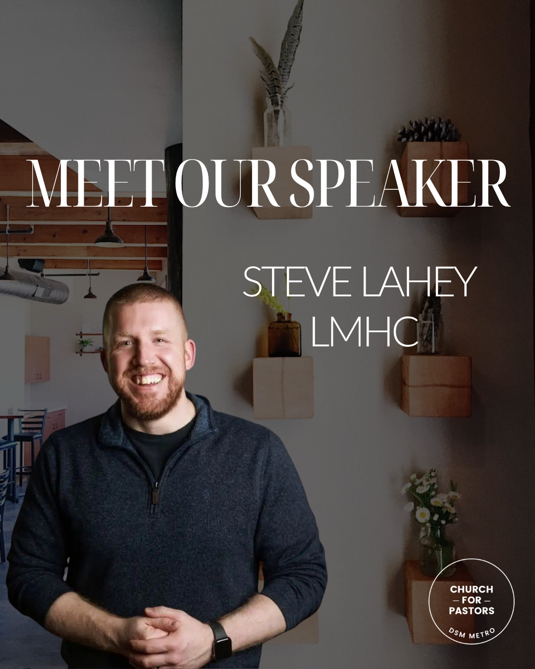 A man smiling in a casual sweater stands in a modern, warmly decorated room with wooden shelves and plants. Overlaid text says, 'Meet Our Speaker Steve Lahey LMHC.'