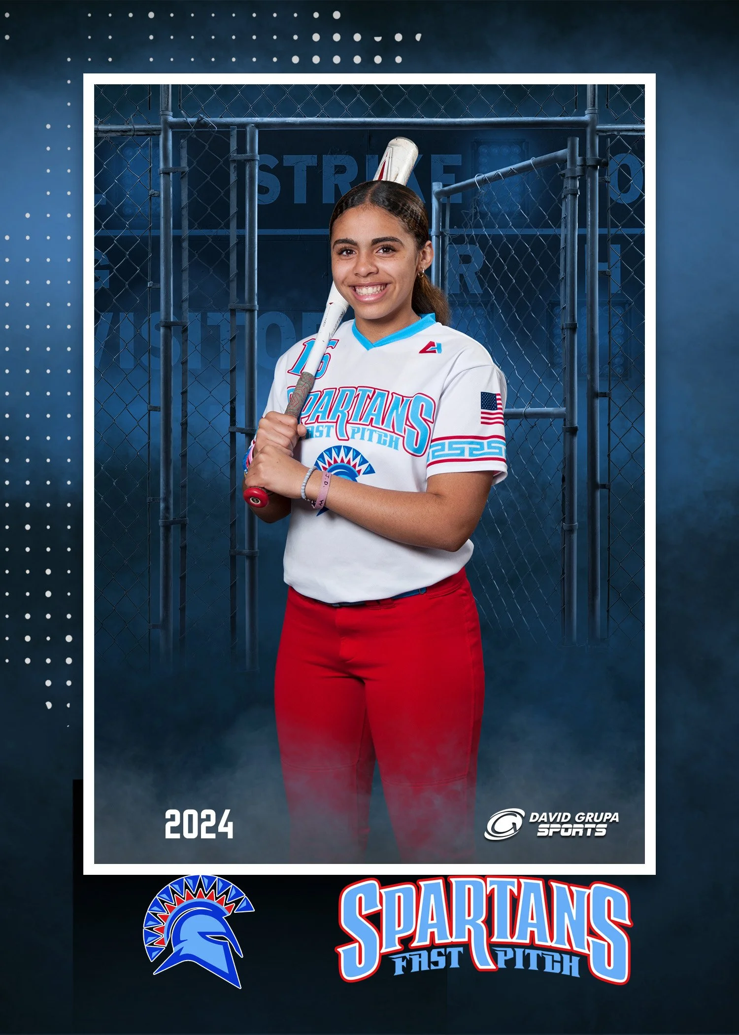 Young woman in a white sports jersey with red pants holding a baseball bat, standing in front of a chain-link fence background with the text "Spartans Fast Pitch 2024" and sports graphics.