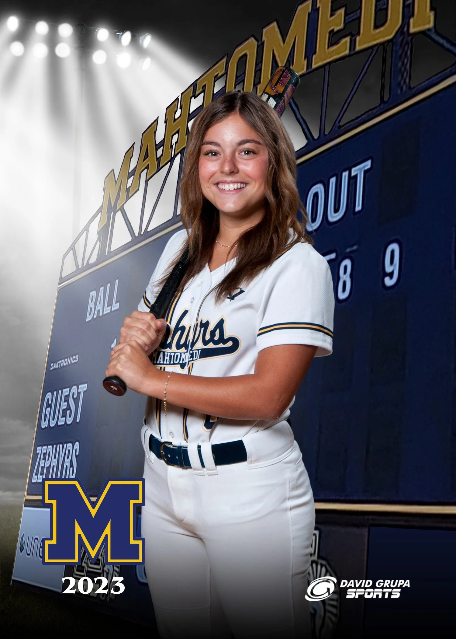A young woman is standing in a baseball uniform holding a baseball bat, smiling at the camera, with a scoreboard in the background showing game details, and an 'M' logo in the lower left corner indicating the year 2023.