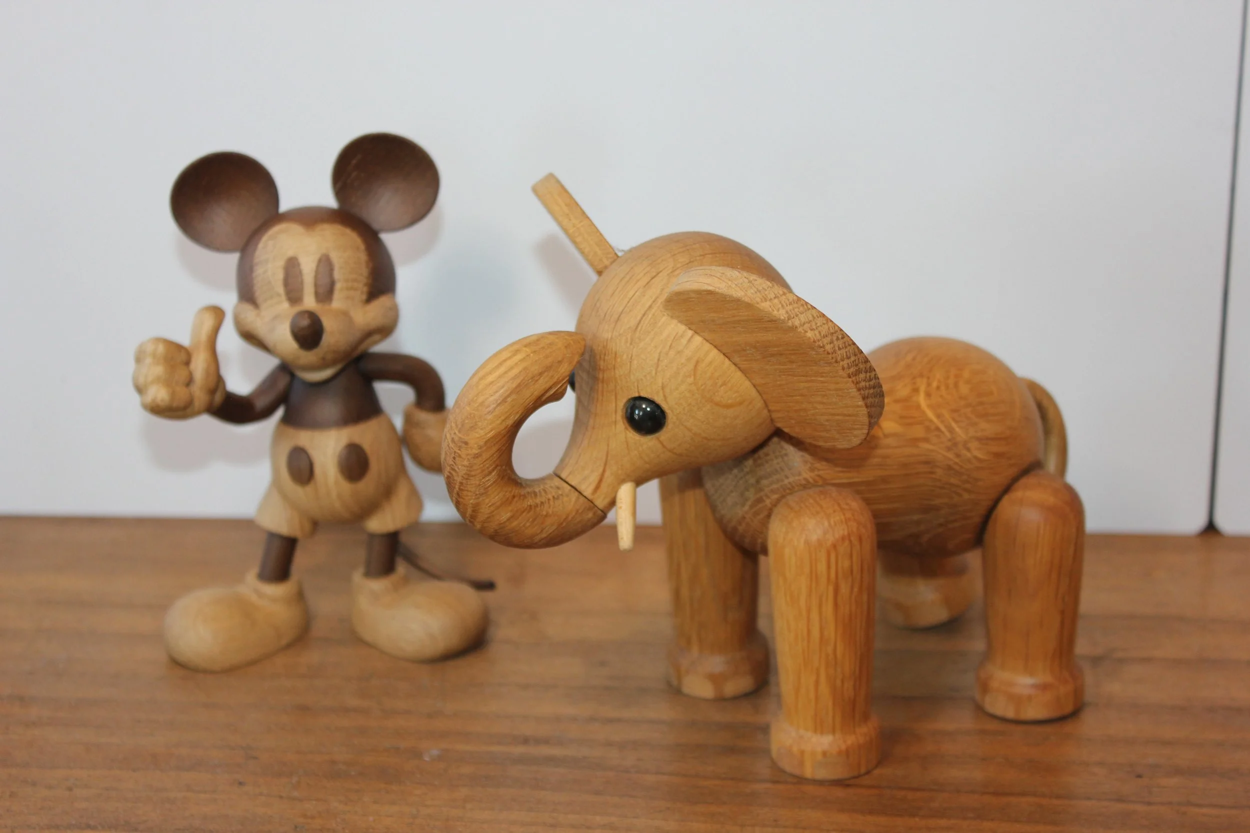 Handmade solid wood elephant and Mickey Mouse figures from Denmark