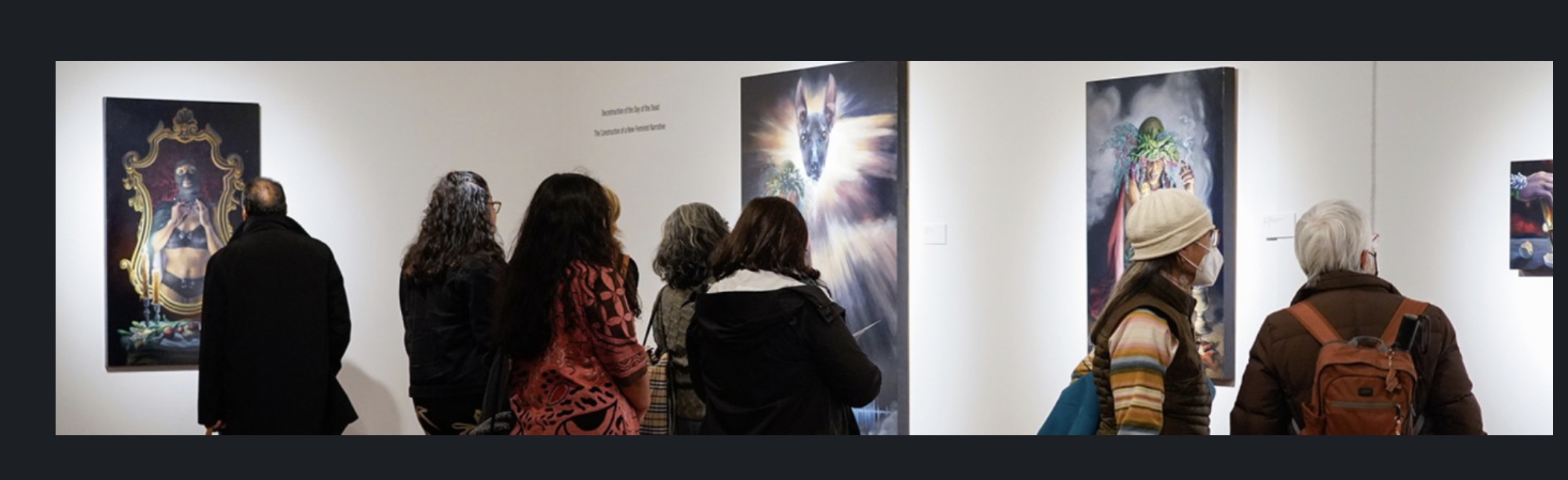 People viewing artwork in an art gallery, with five women and two men observing colorful paintings on the walls.