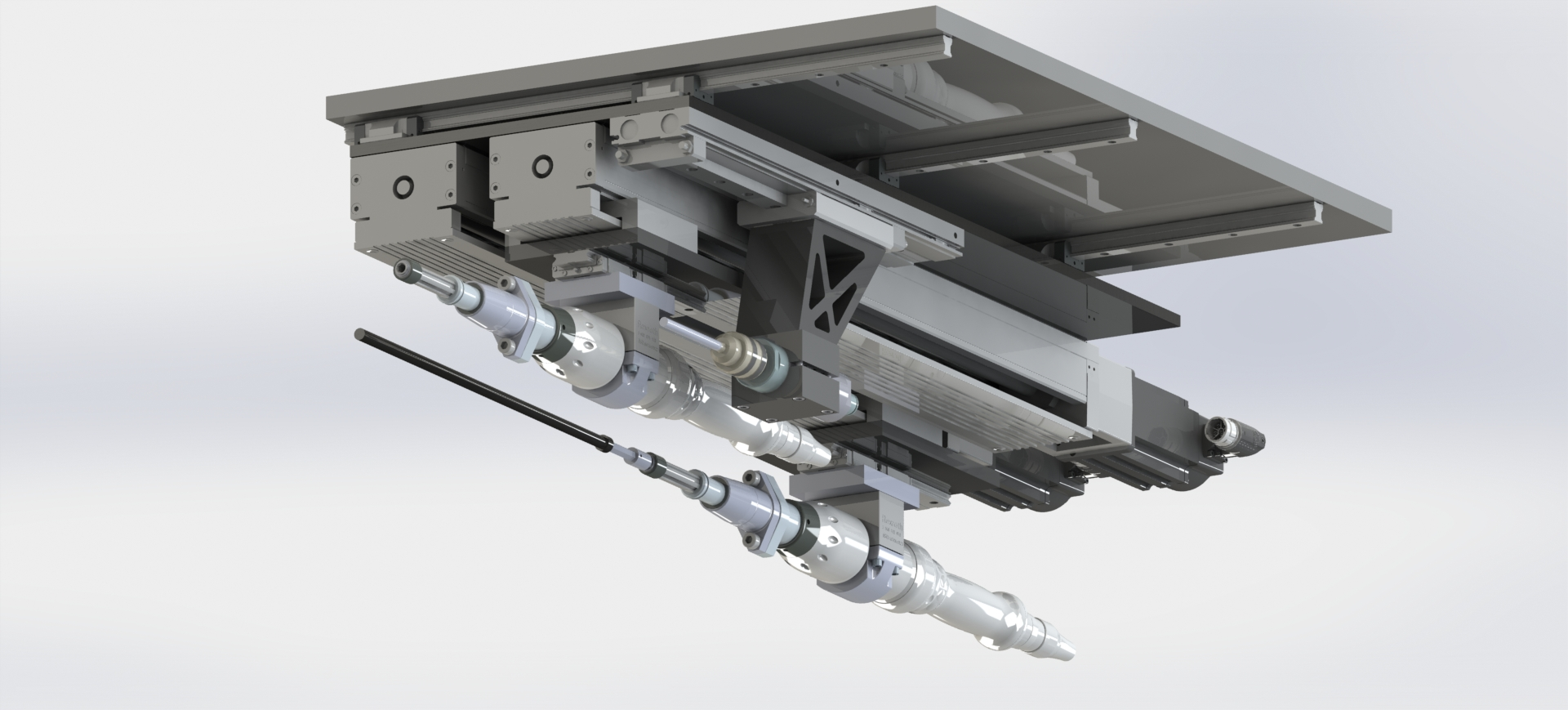 A detailed view of a machine with various mechanical and electronic components, including cylinders, actuators, and rails, likely used in manufacturing or automation systems.