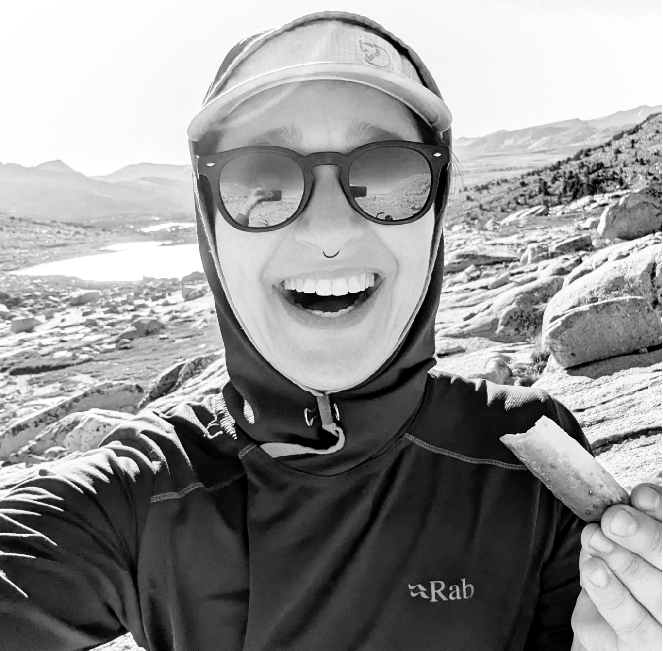 August Kellman on a hike eating a pickle