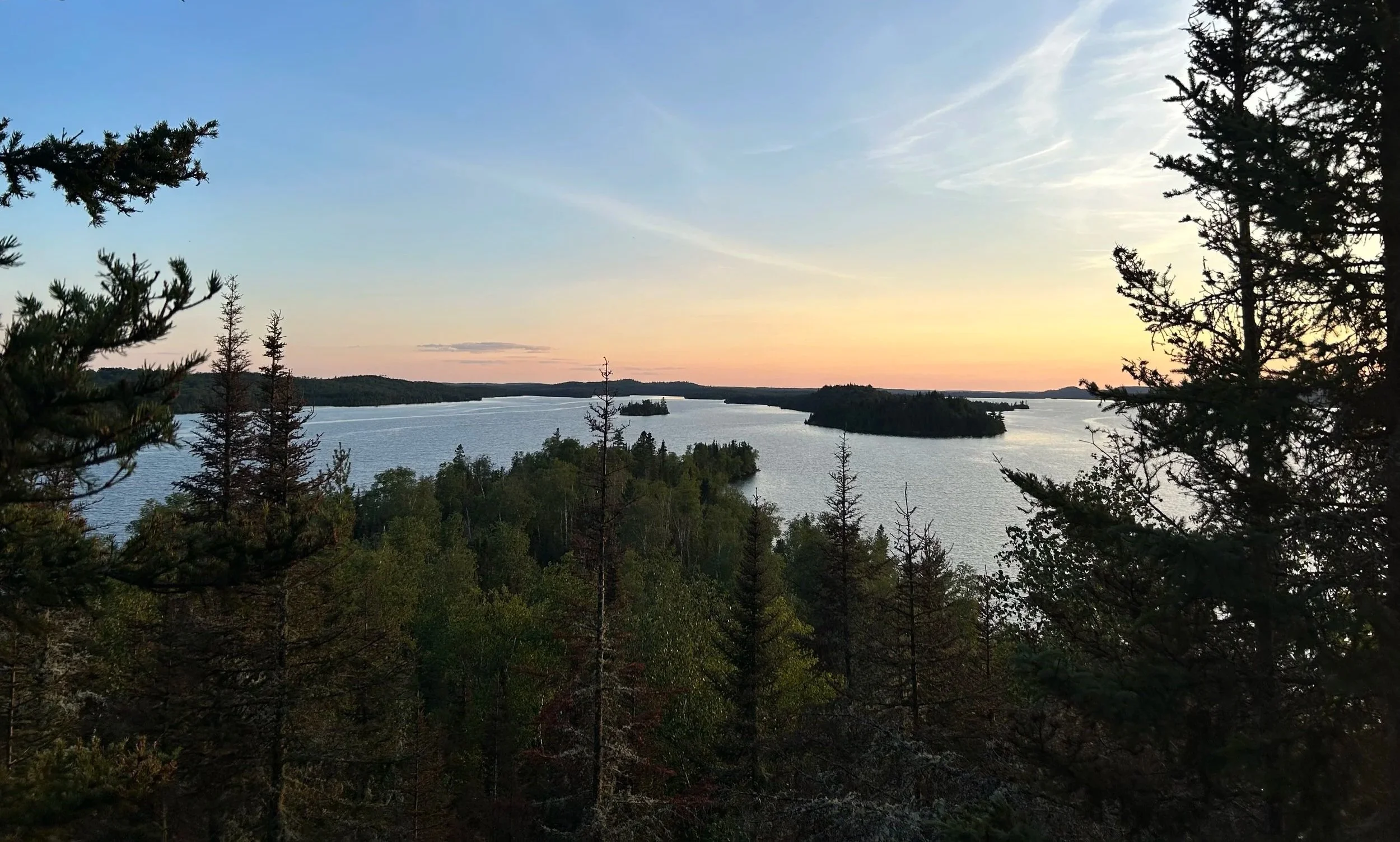 Forested islands on a lake.