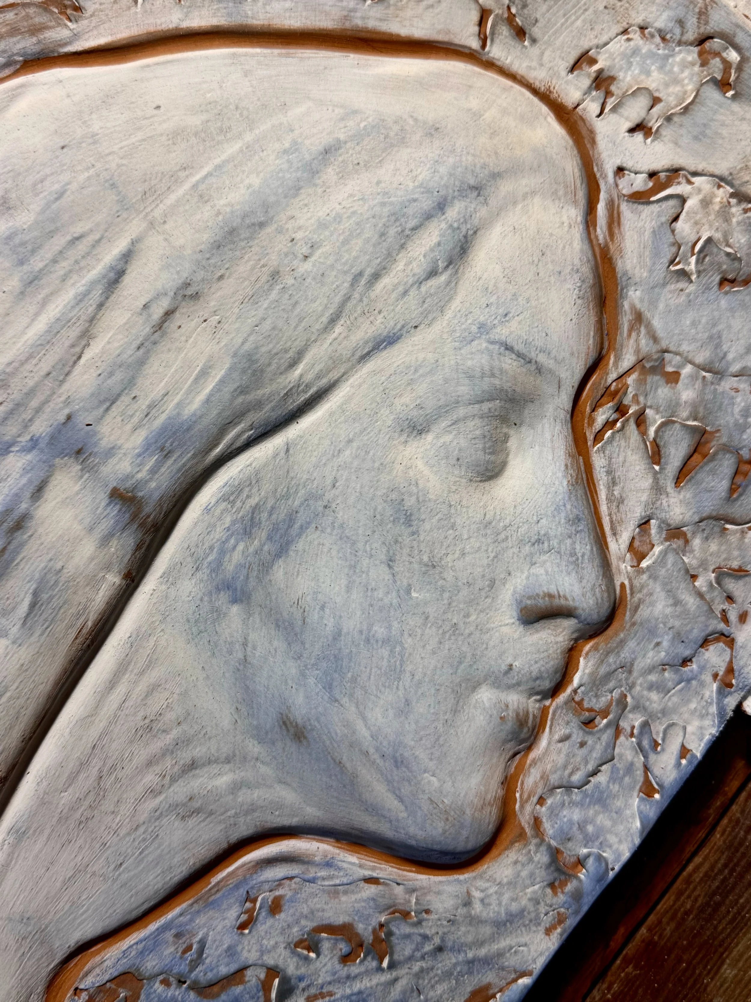Handcrafted terracotta architectural relief with organic carved lines by Il Cavallo Verde Studio