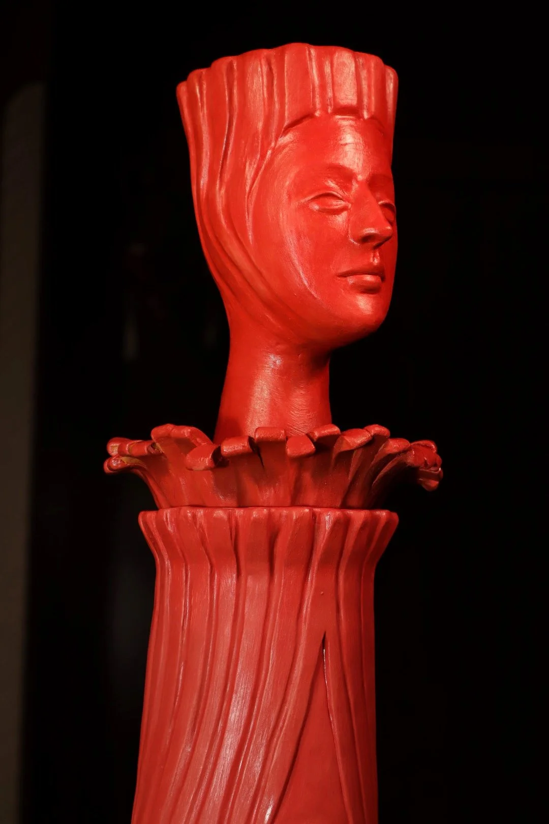 Contemporary handmade terracotta sculpture with a stylised human head, created by ceramic artist Elahe Shirzadeh.