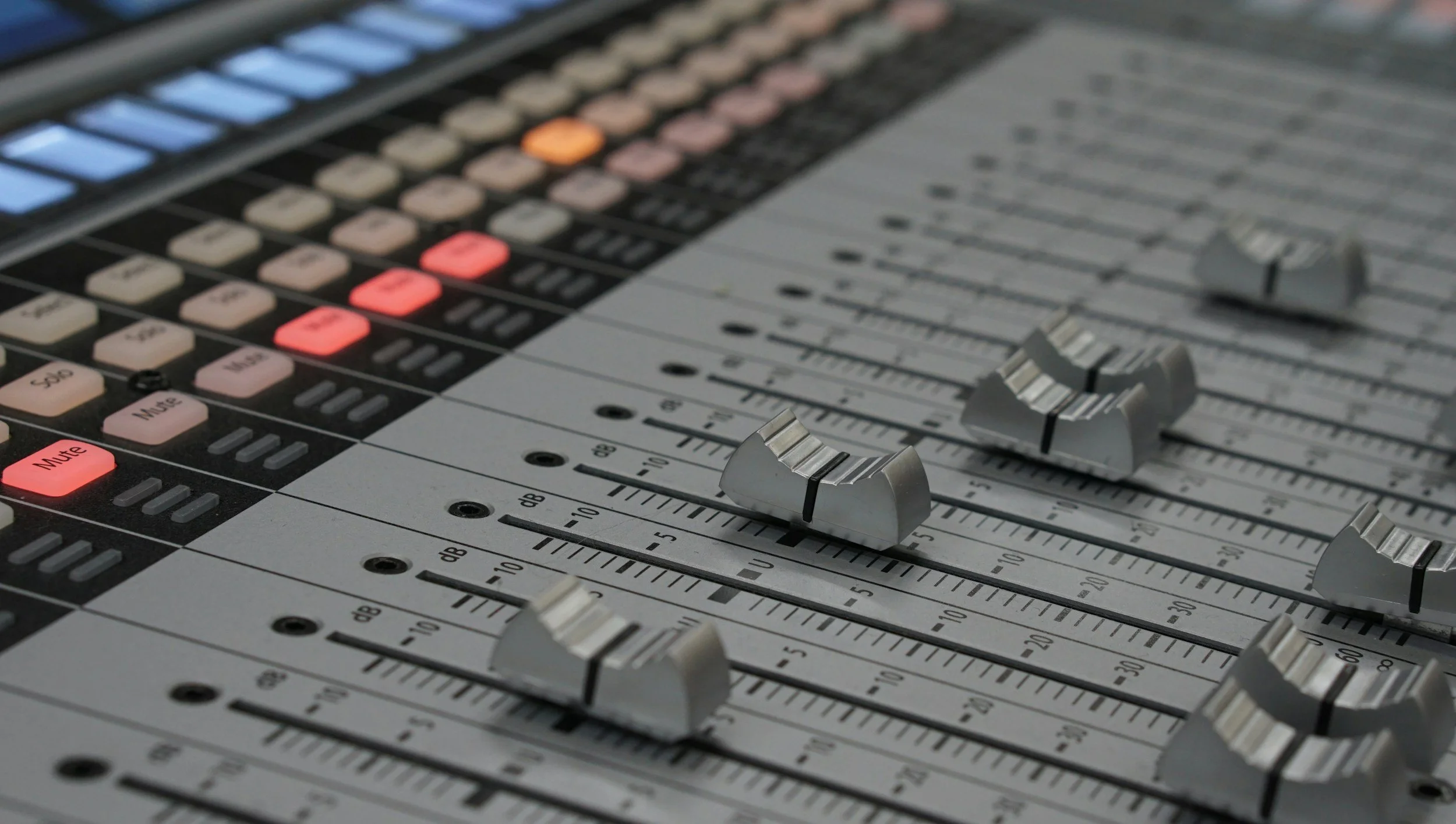 Mixing tracks on a studio console