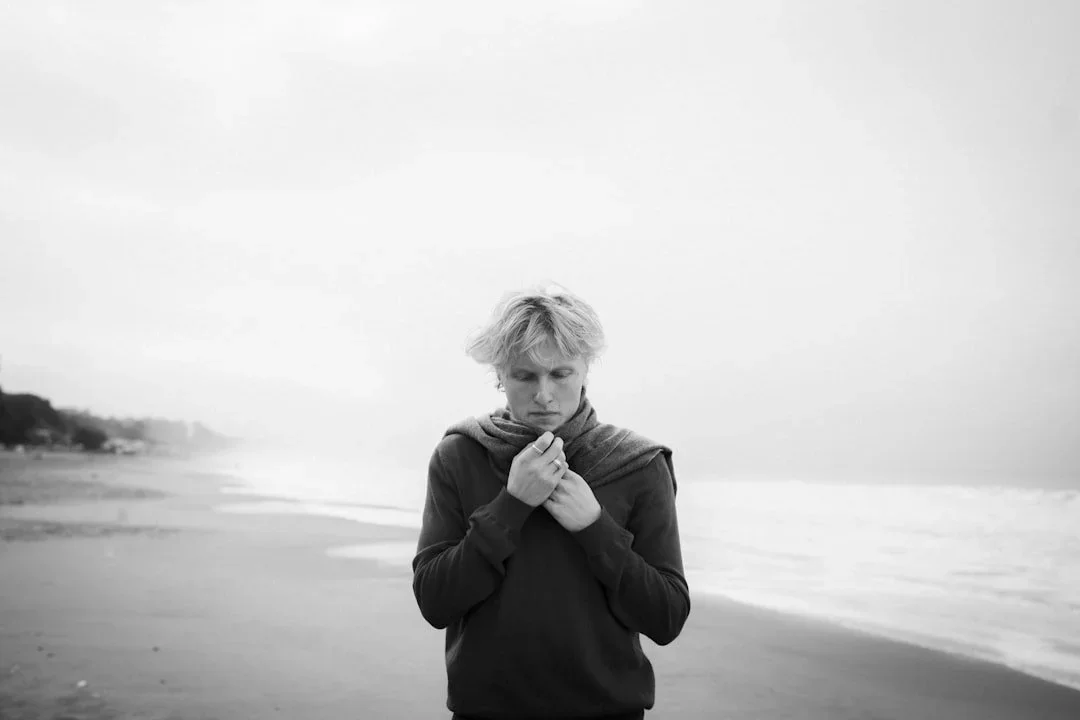 Music artist on a beach.