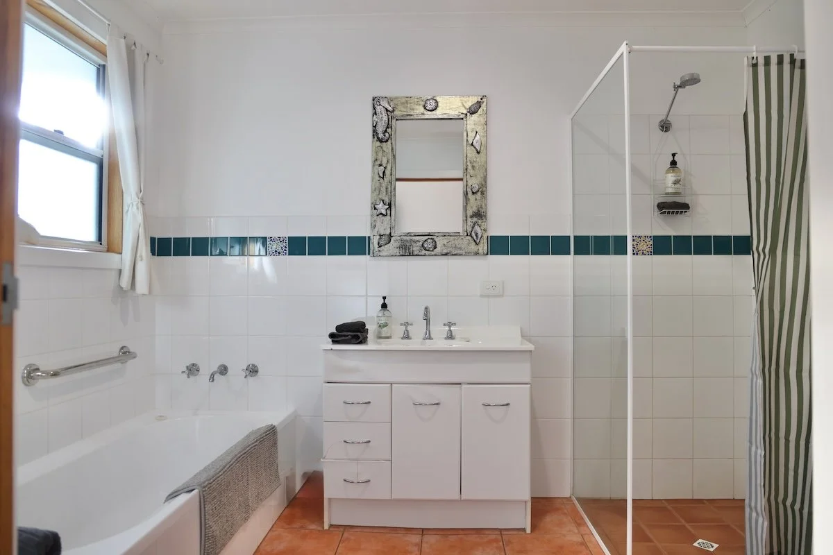 Spacious bathroom with grab rails