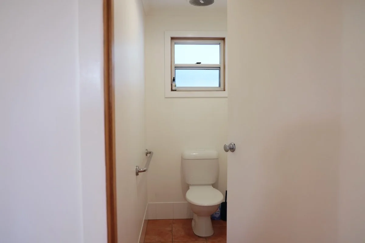 Separate toilet with grab rails