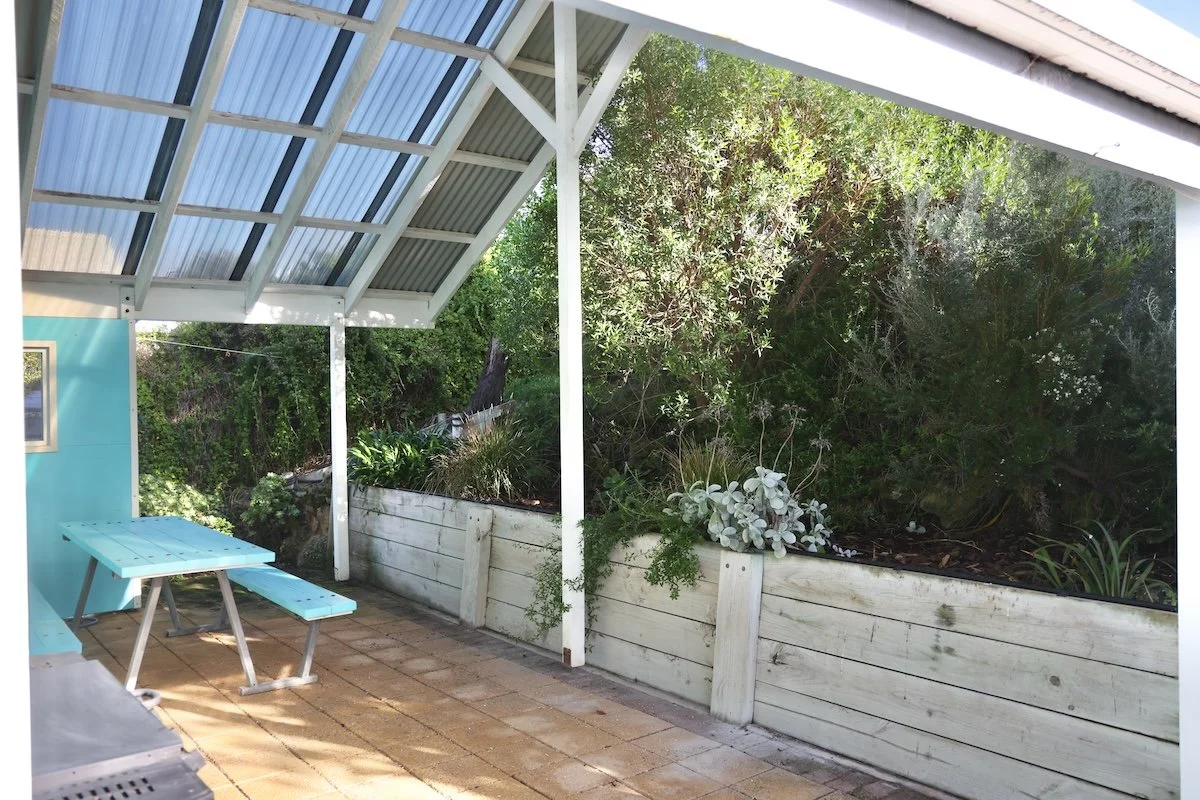 Secure patio with BBQ and seating