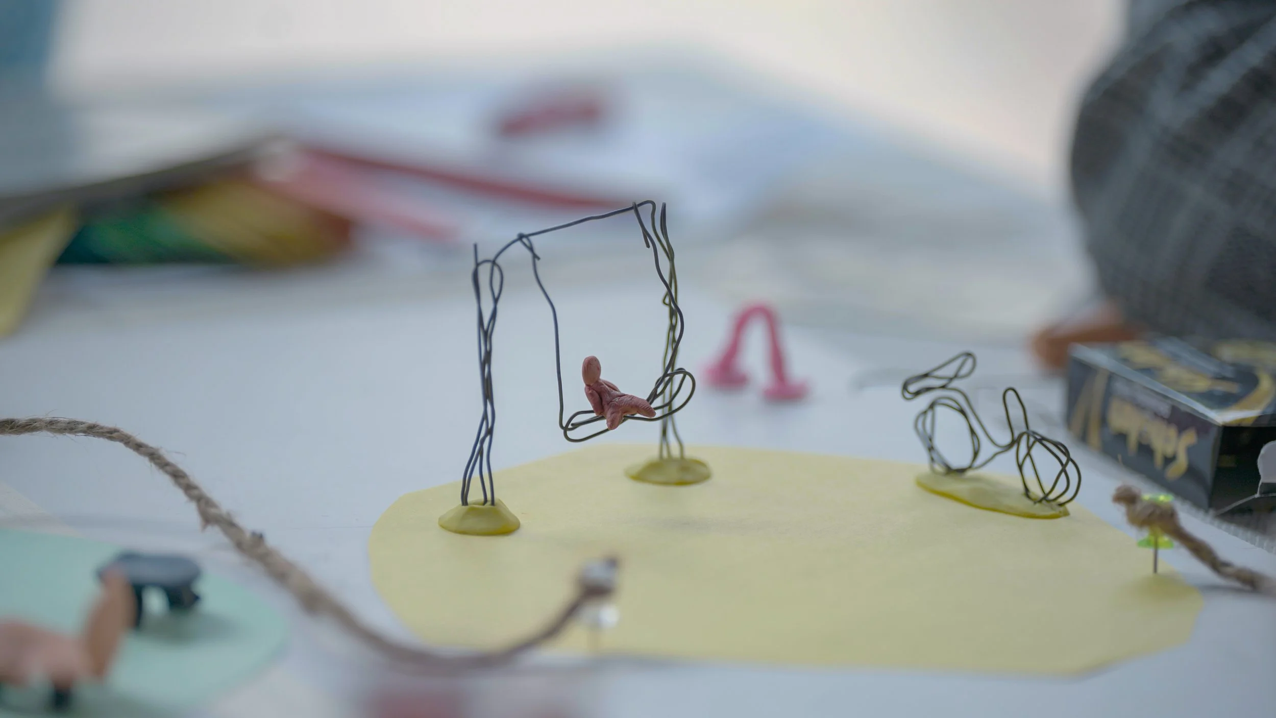 Close-up of a wire figure on a swing, a speculative prototype made during the Alternative Digital Futures participatory futures workshop by Lagori Collective and partners.