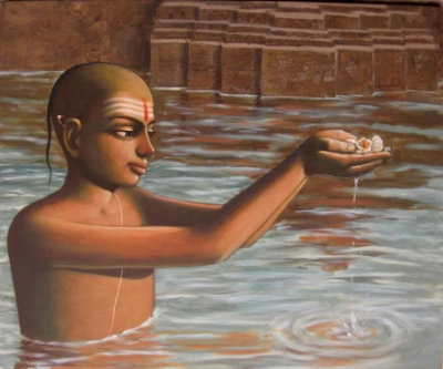 A man in water with traditional markings on her face, holding a small object in her outstretched hand.