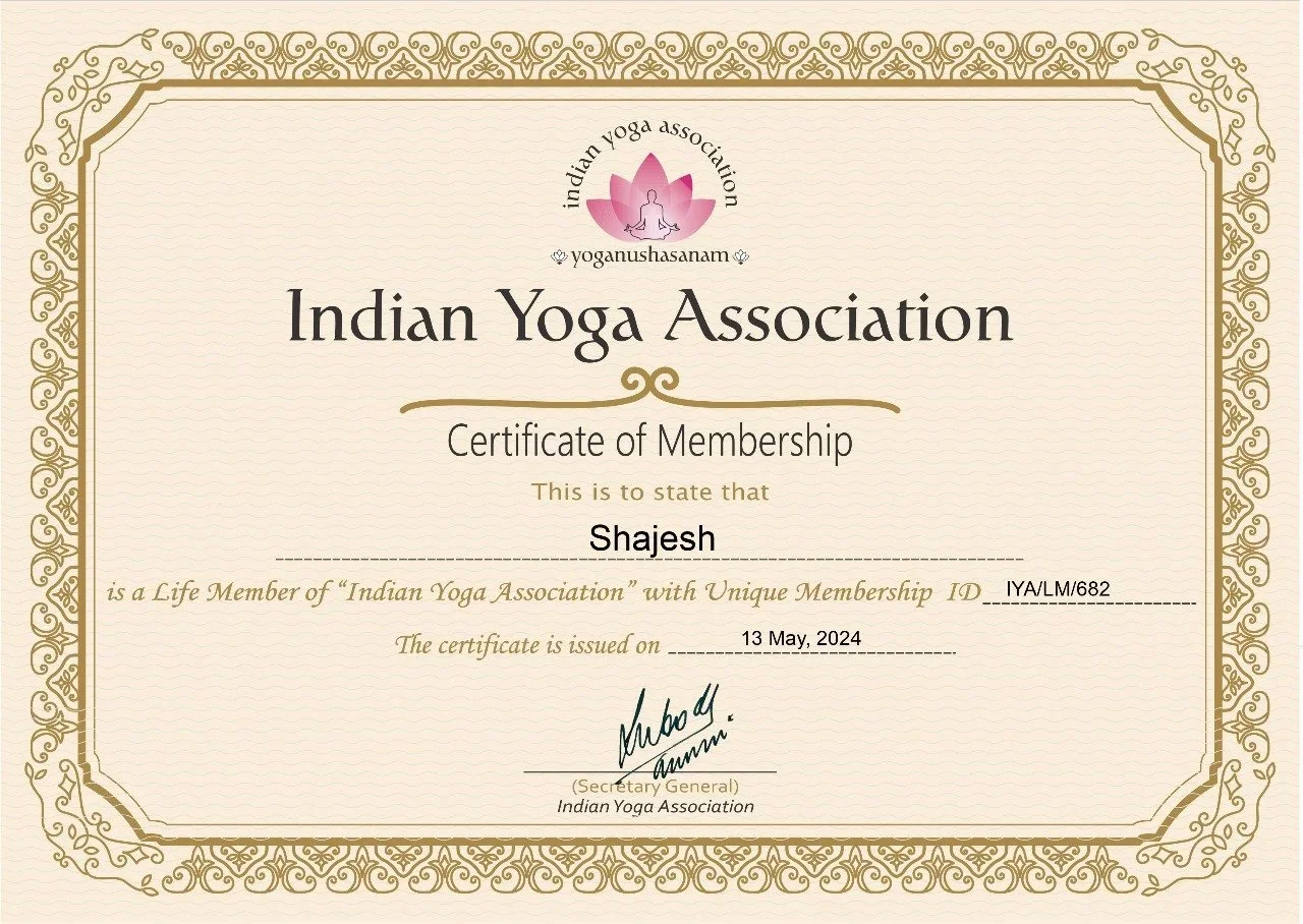 Certificate of membership from the Indian Yoga Association awarded to Shajesh, issued on May 13, 2024, with a decorative gold border and pink lotus logo at the top.