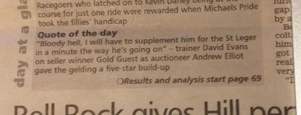 Close-up of a newspaper article with the headline 'Quote of the day' and a quote about suppressing someone for the St Ledger, mentioning trainer David Evans and auctioneer Andrew Elliot, with a note indicating results and analysis starting on page 69.