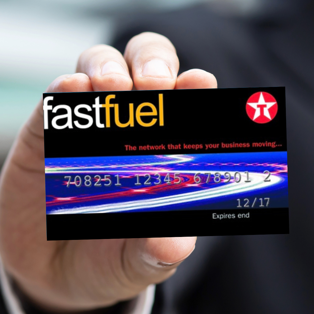 Close-up of a hand holding a Texas fast fuel prepaid card with a black background, colorful light streaks, and text indicating the card's expiration date as 12/17.