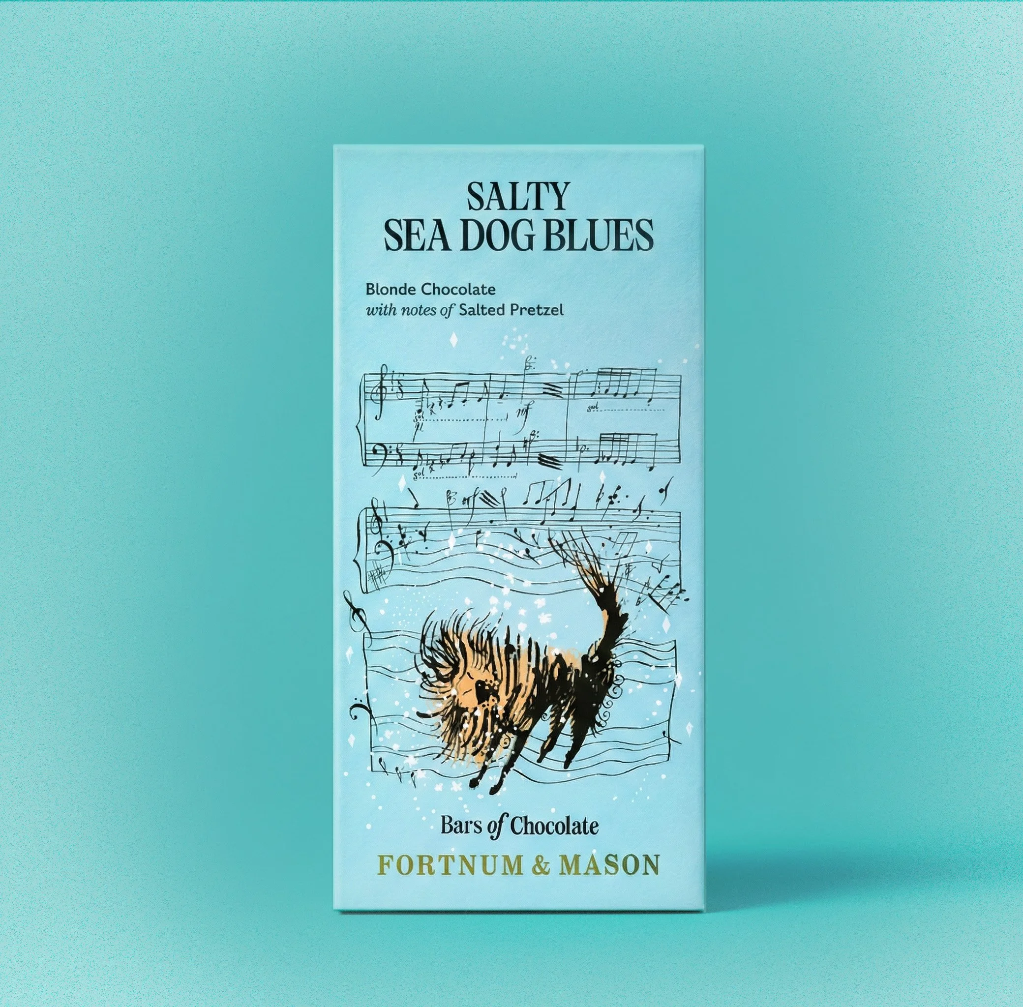 Bars of Chocolate packaging Fortnum and Mason. Salty Sea Dog Blues chocolate bars featuring a blue background, musical notes, and a sketch of a black dog with a lion mane.