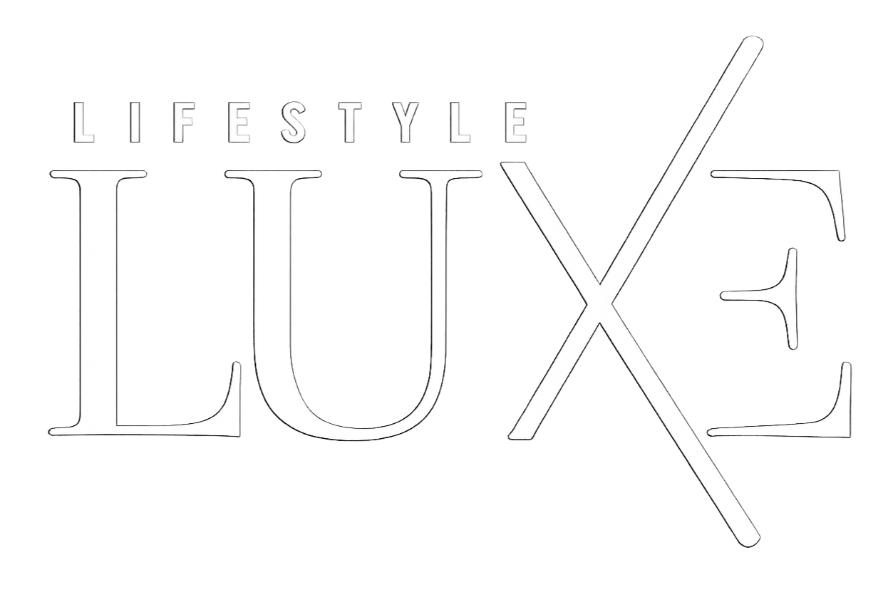Logo with the words "LIFESTYLE LUXE" in stylized text, with a diagonal line crossing through the letter 'X'.