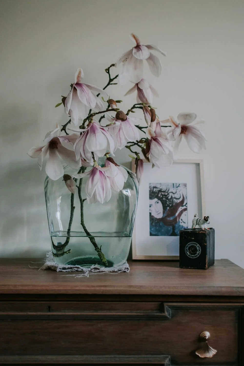 Pink and white Magnolia blossom in a glass vase | A Wholesome Life | Josephine Brooks