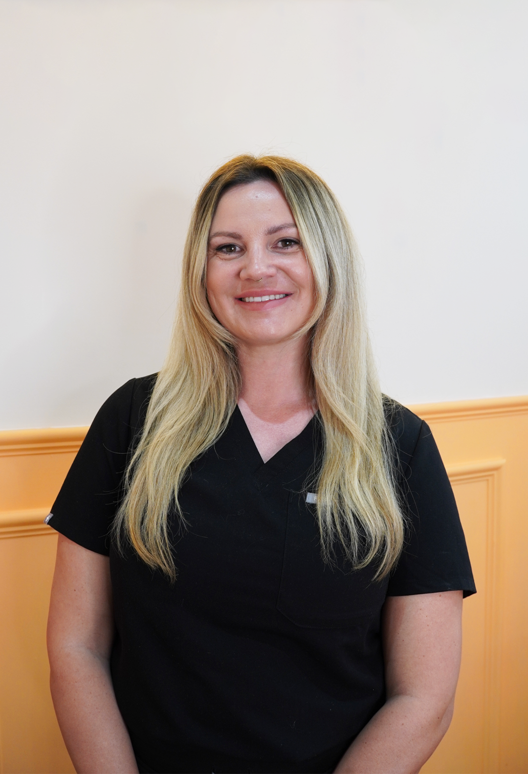 Lauren, laser therapist at Leigh-on-Sea Laser Clinic using the Eneka Pro Laser Hair Removal Machine