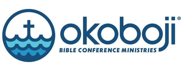 Logo of OKOBI Bible Conference Ministries featuring a stylized boat on water with the text 'OKOBI Bible Conference Ministries'.