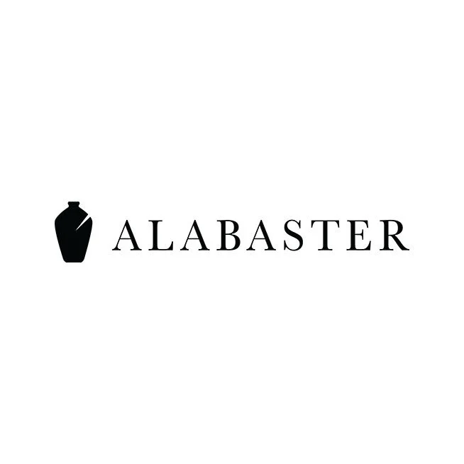 Logo with a black silhouette of a mortar and pestle next to the word 'ALABASTER' in black capital letters.