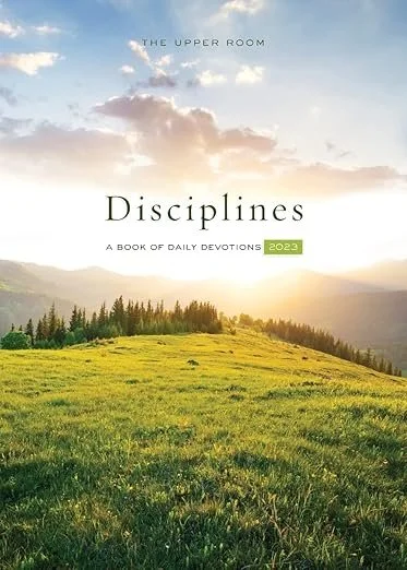 Cover of a book titled 'Disciplines' with a landscape of green grass and distant trees under a partly cloudy sky at sunset.