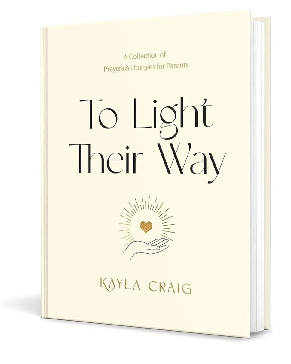 Book titled 'To Light Their Way' by Kayla Craig, featuring a simple cover design with a hand holding a sunburst and heart icon.