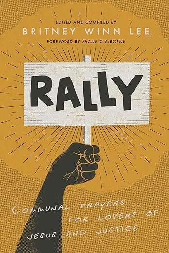 Book cover titled 'Rally,' edited by Britney Winn Lee, with a foreword by Shane Claiborne. The cover features a black hand holding a protest sign with the title, against a yellow background with radiating lines. The subtitle reads 'Communal Prayers for Lovers of Jesus and Justice.'