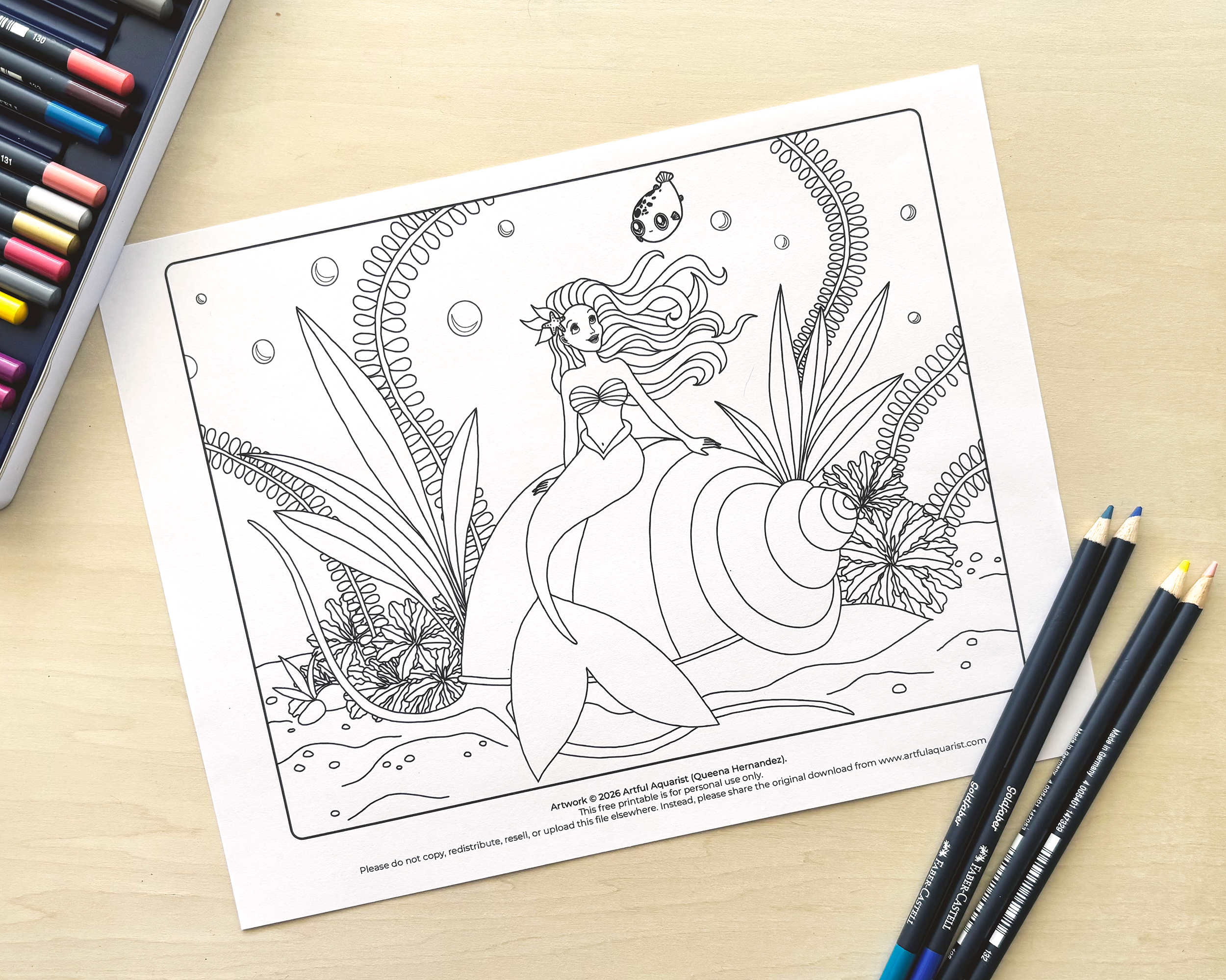 Black and white coloring page featuring a mermaid with long flowing hair sitting among large tropical leaves and flowers, with bubbles and a small fish nearby.