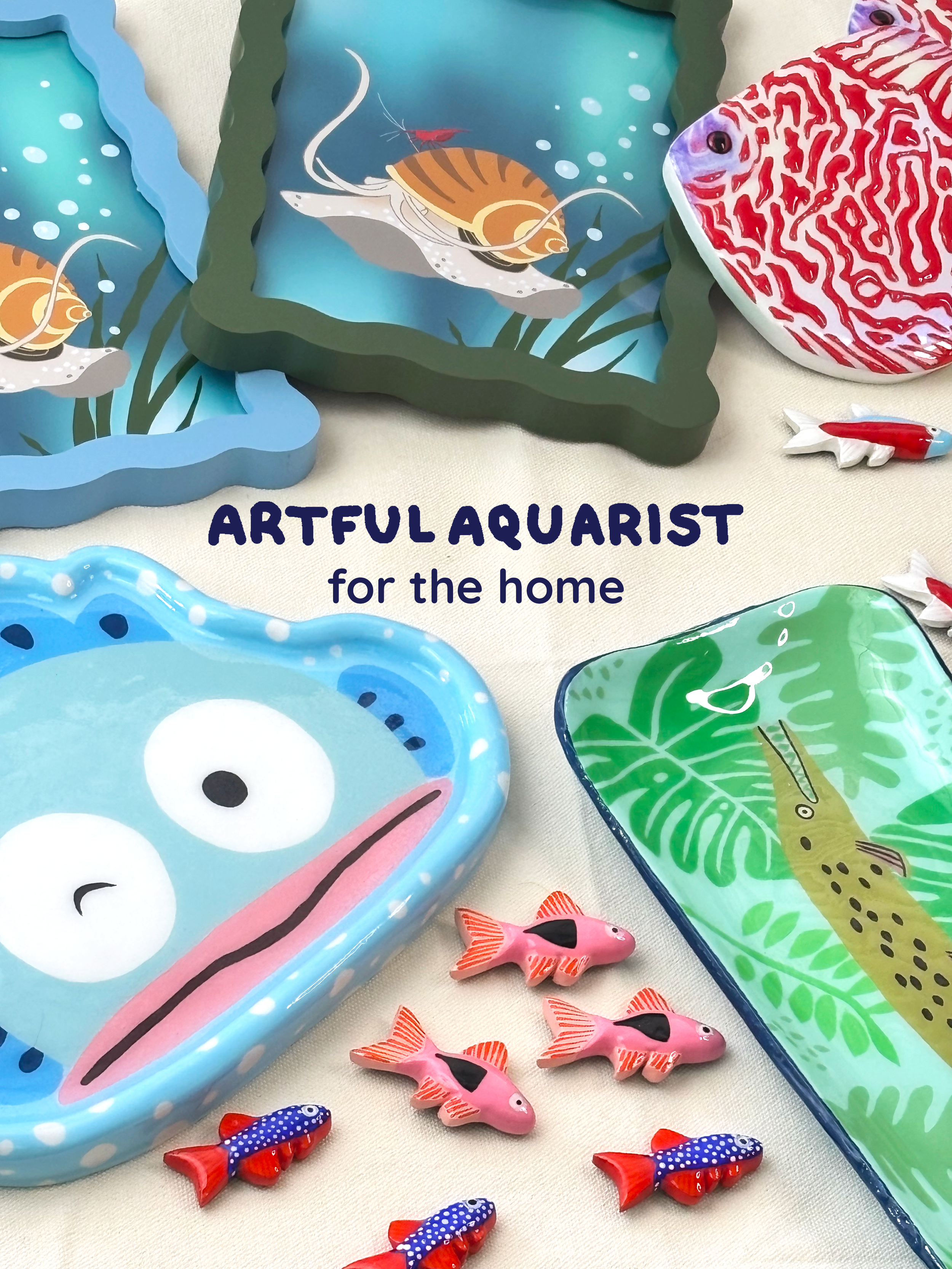 A collection of colorful ceramic or plastic decorative items, including fish-shaped and animal-shaped dishes and figurines with ocean or jungle themes, displayed on a light surface.