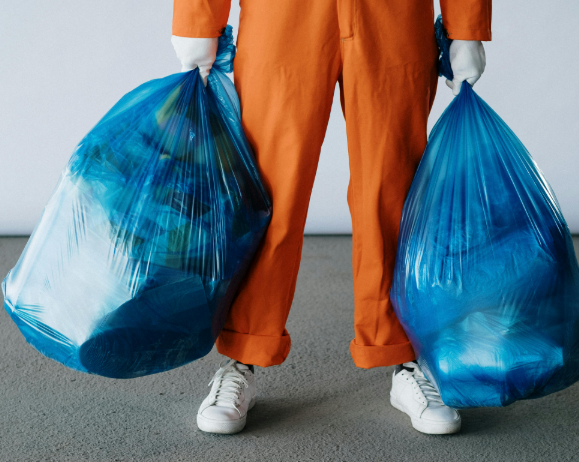 Professional cleaner collecting trash